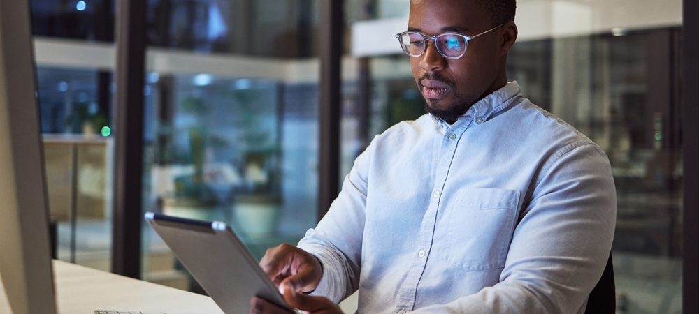 Black,Businessman,,Tablet,And,Data,Analysis,With,Computer,In,Night
